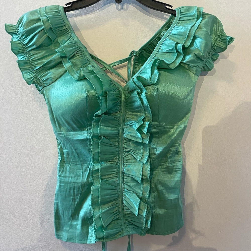 This corsetish backless turquoise top